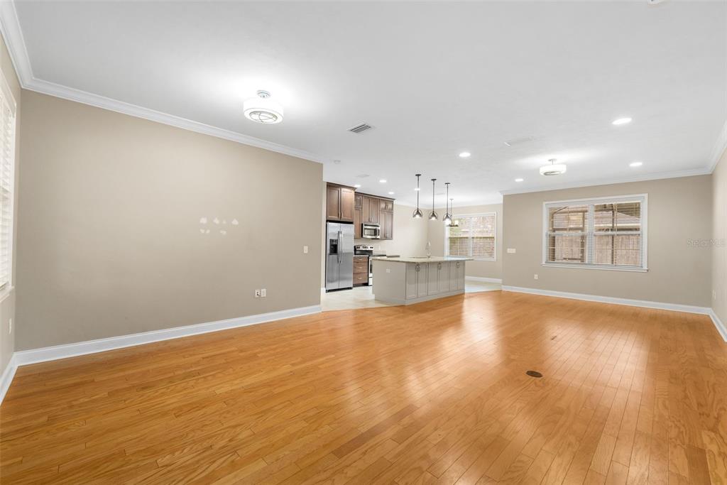 16617 Northwest 194th Street High Springs, FL 32643 - Photo 5 of 32 a view of kitchen with kitchen island sink and wooden floor