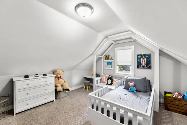 a bedroom with furniture and a window