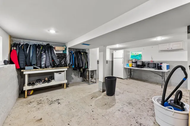 a view of a living room with furniture and a flat screen tv