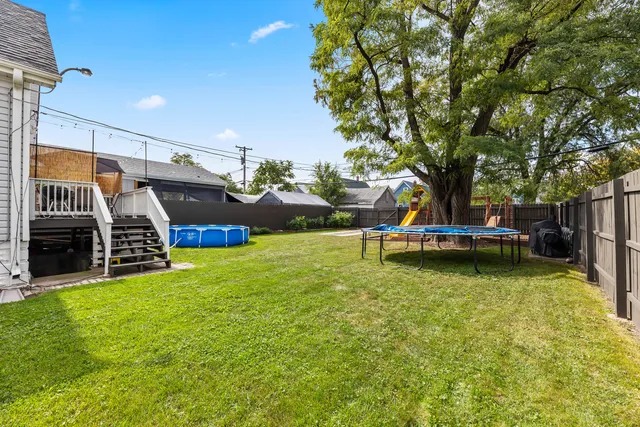 a view of a house with backyard and a slide