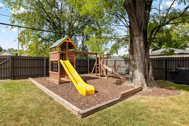 a view of a backyard with a slide