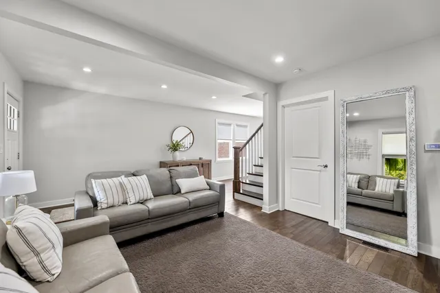 a living room with furniture and white walls