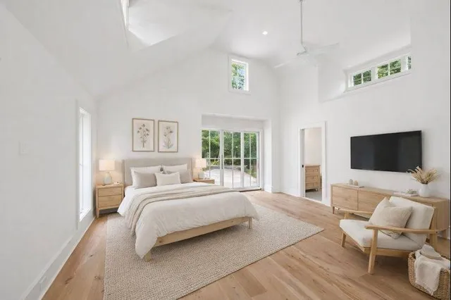 a bedroom with a bed and a chair