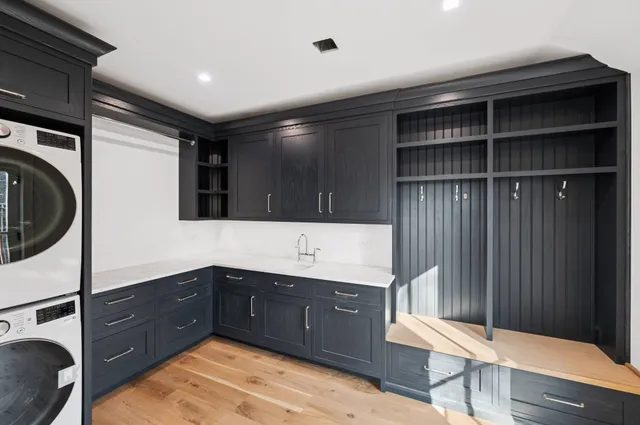 a kitchen with a sink and cabinets