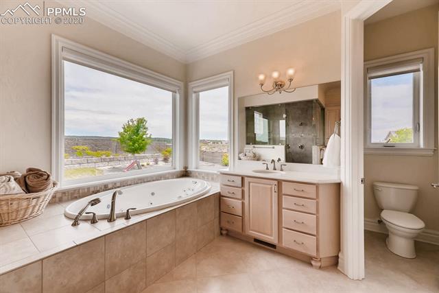 13505 Random Ridge View Colorado Springs, CO 80921 - Photo 21 of 33 second sink/large shower/remote controlled window coverings
