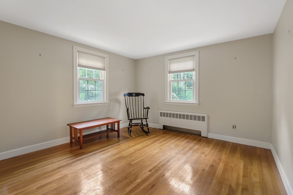 21 Cutler Drive Ashland, MA 01721 - Photo 12 of 34 a view of room with hardwood floor and a window