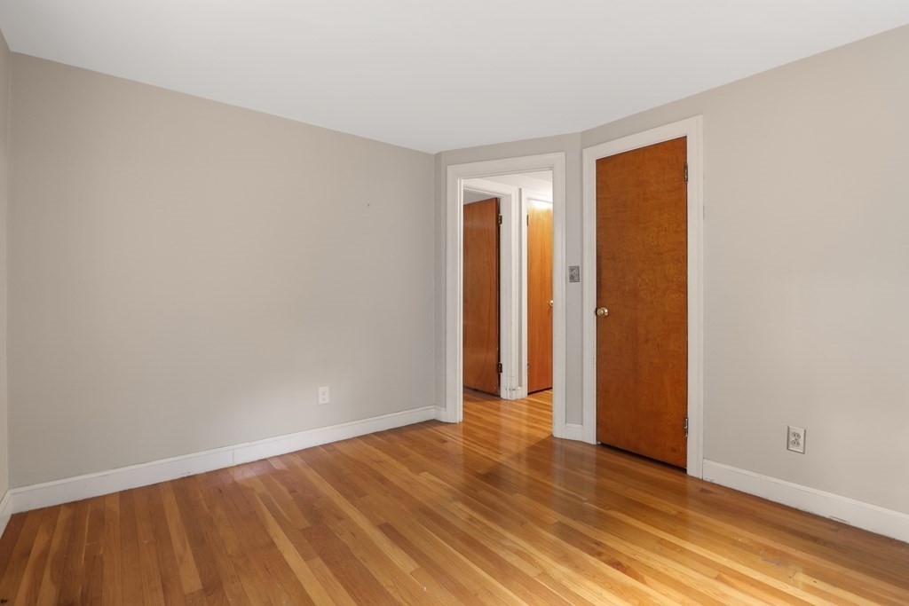 21 Cutler Drive Ashland, MA 01721 - Photo 14 of 34 a view of an empty room with wooden floor