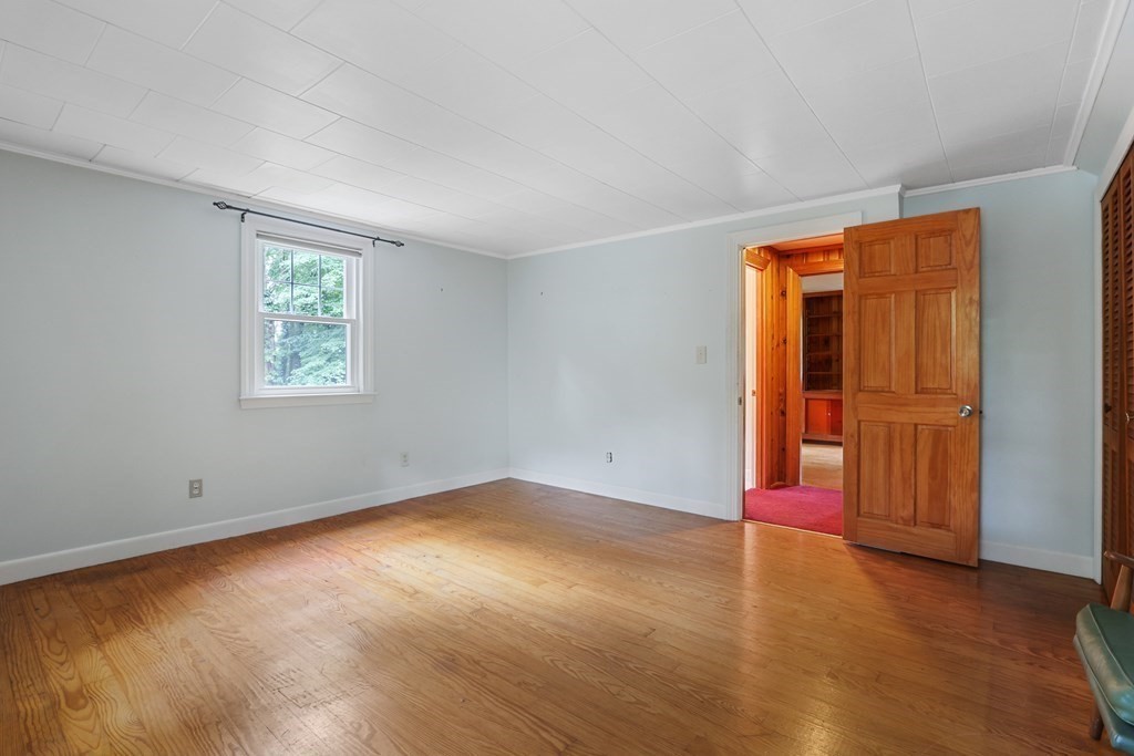 21 Cutler Drive Ashland, MA 01721 - Photo 19 of 34 wooden floor in an empty room with a window