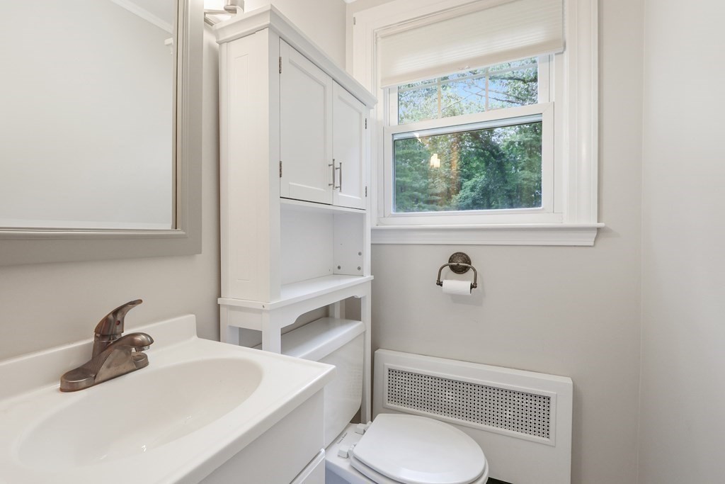 21 Cutler Drive Ashland, MA 01721 - Photo 20 of 34 a bathroom with a sink a toilet and a mirror