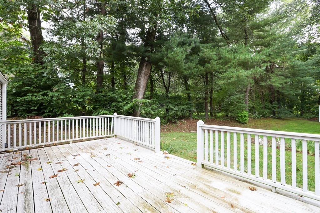 21 Cutler Drive Ashland, MA 01721 - Photo 26 of 34 a balcony with wooden floor and fence