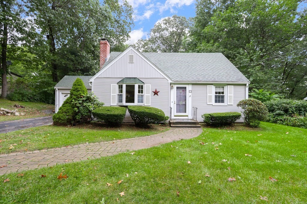 21 Cutler Drive Ashland, MA 01721 - Photo 3 of 34 a front view of a house with a garden