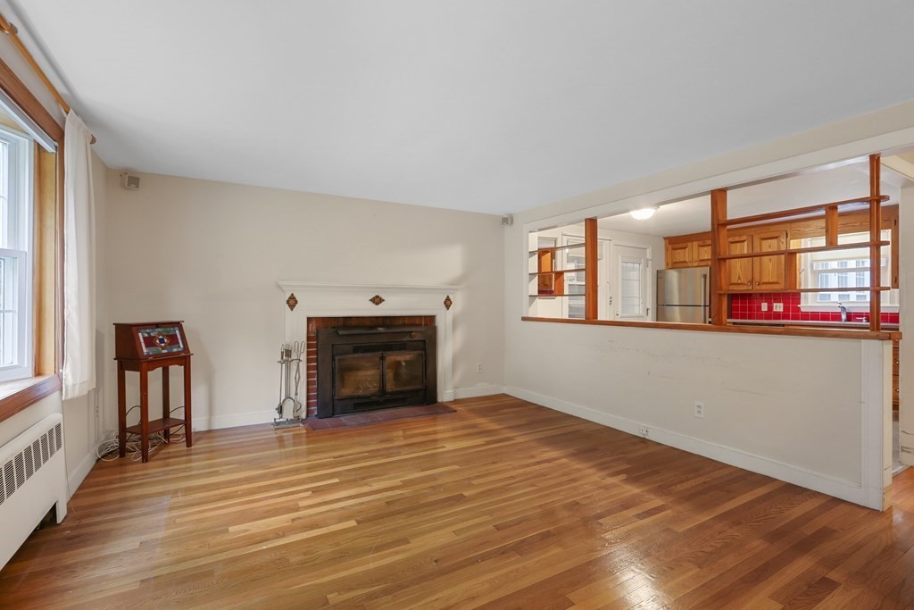 21 Cutler Drive Ashland, MA 01721 - Photo 5 of 34 a view of an empty room with window and fire place