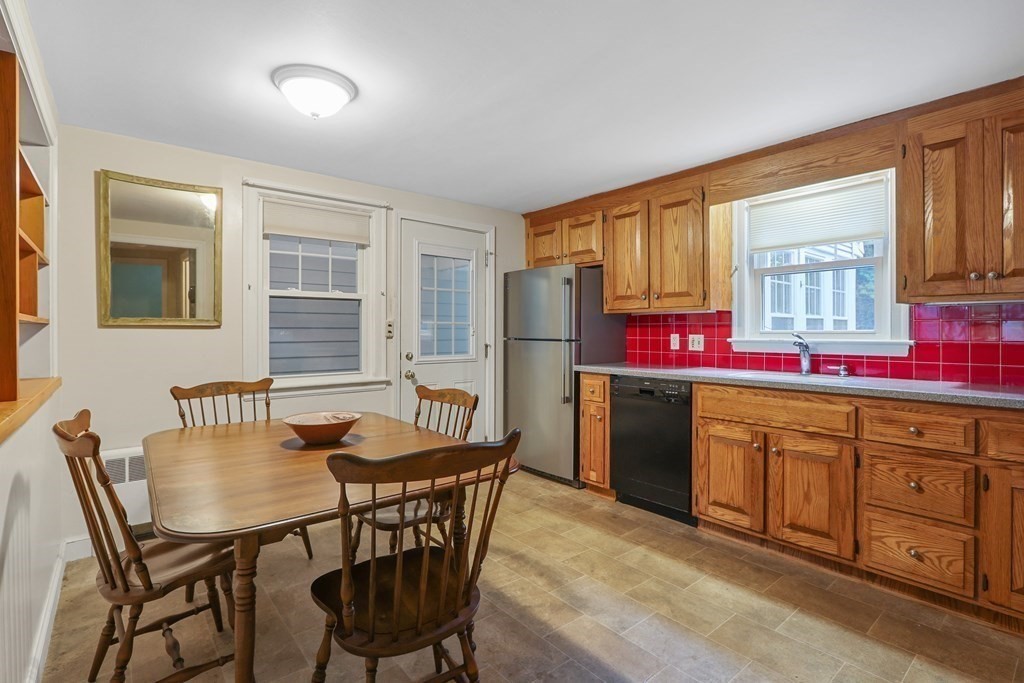 21 Cutler Drive Ashland, MA 01721 - Photo 9 of 34 a view of a dining room with furniture and window