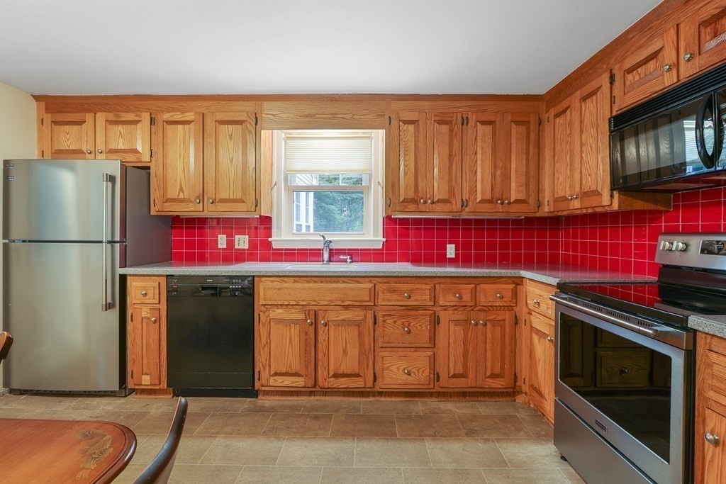 21 Cutler Drive Ashland, MA 01721 - Photo 10 of 34 a kitchen with stainless steel appliances granite countertop a refrigerator a stove a sink and dishwasher