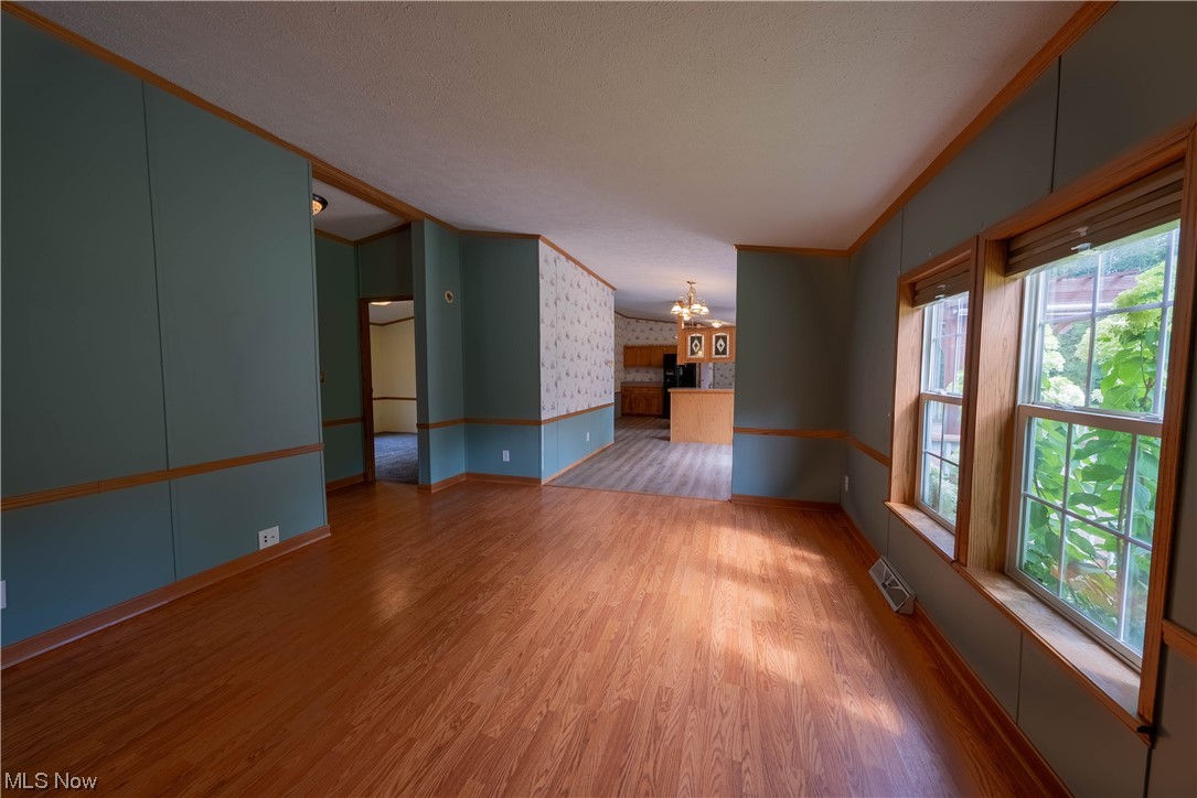 5000 Hoffman Road Rome, OH 44085 - Photo 22 of 34 Wood floored empty room featuring crown molding