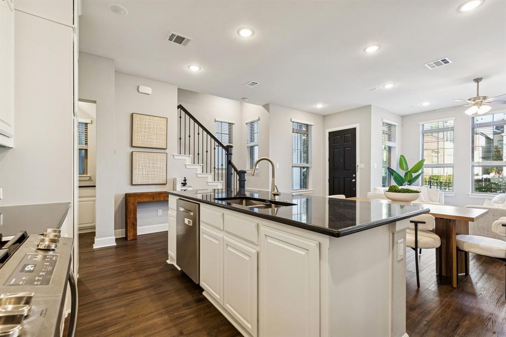 7119 Amber Grove Dallas, TX 75231 - Photo 12 of 30 a kitchen with counter top space and sink