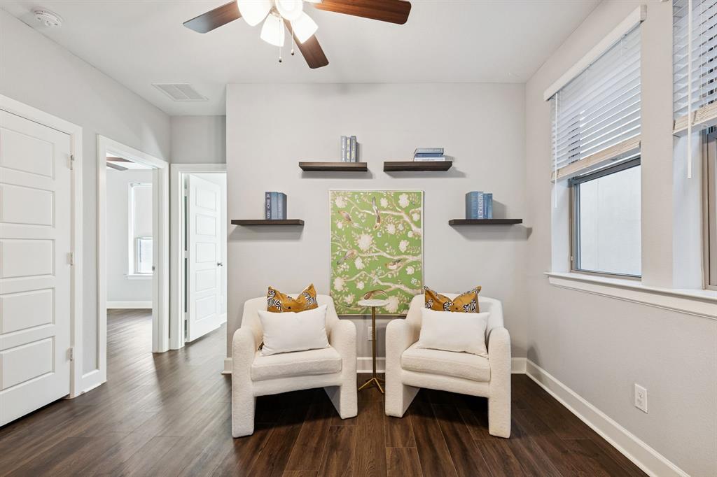 7119 Amber Grove Dallas, TX 75231 - Photo 13 of 30 a living room with furniture and a wooden floor