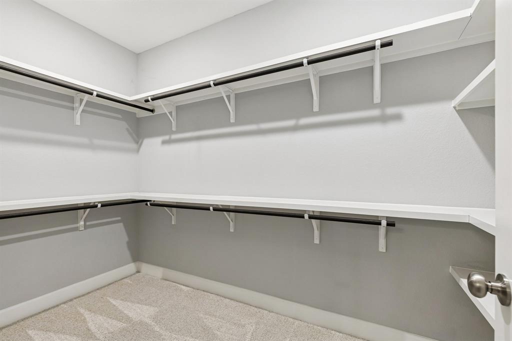 7119 Amber Grove Dallas, TX 75231 - Photo 21 of 30 a view of an empty walk in closet