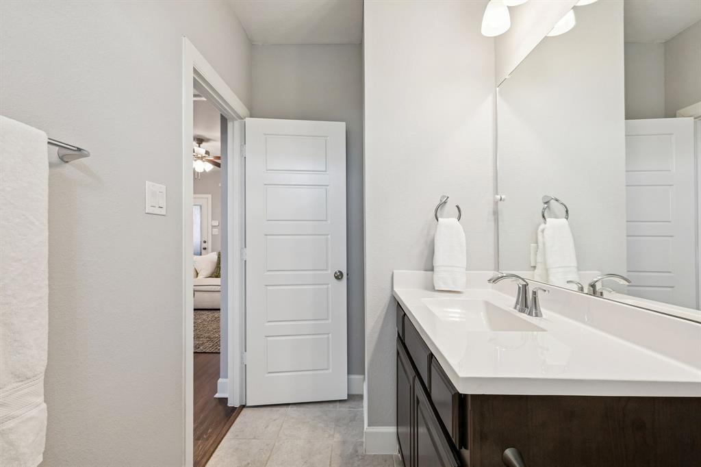 7119 Amber Grove Dallas, TX 75231 - Photo 23 of 30 a bathroom with a sink and a mirror