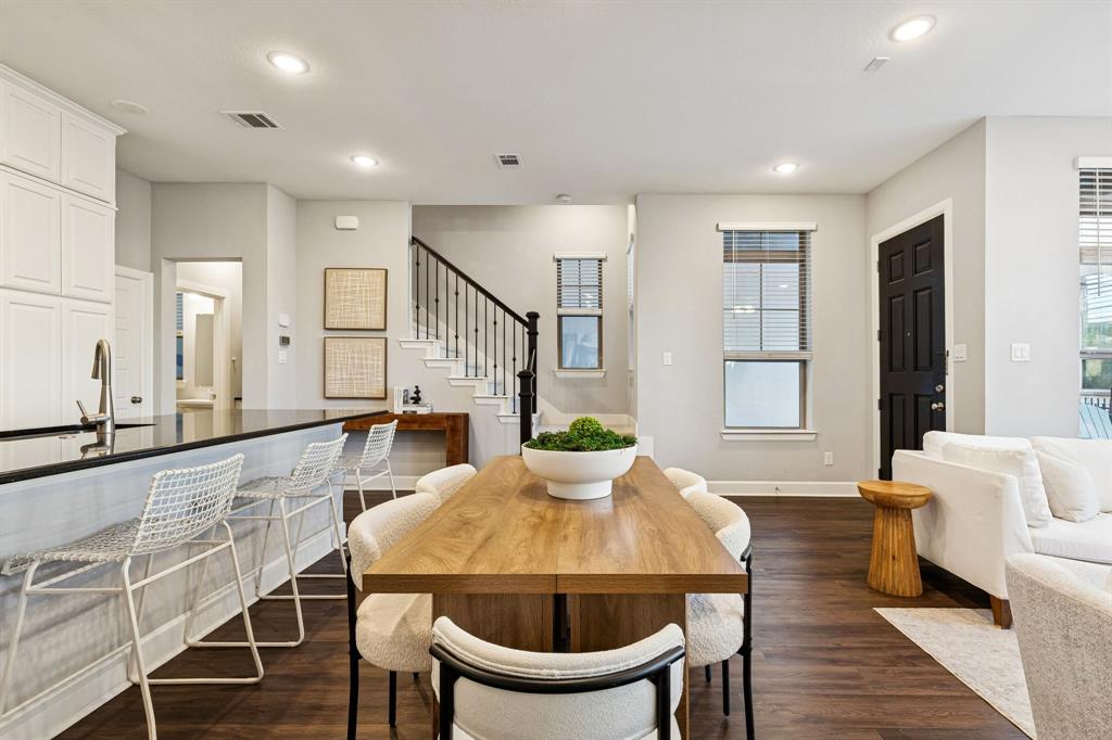 7119 Amber Grove Dallas, TX 75231 - Photo 8 of 30 a view of a a dining room with furniture window and wooden floor