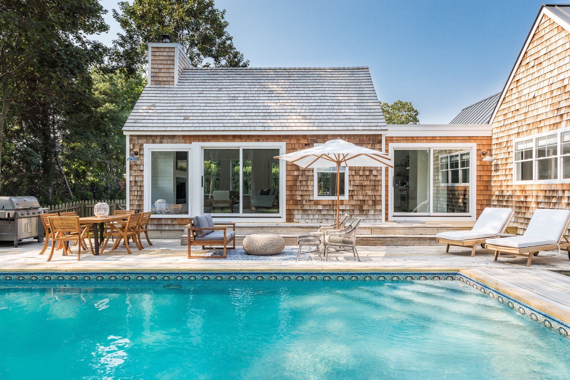 54 Norris Lane Bridgehampton, NY 11932 - Photo 6 of 15 a front view of house with outdoor seating and garden