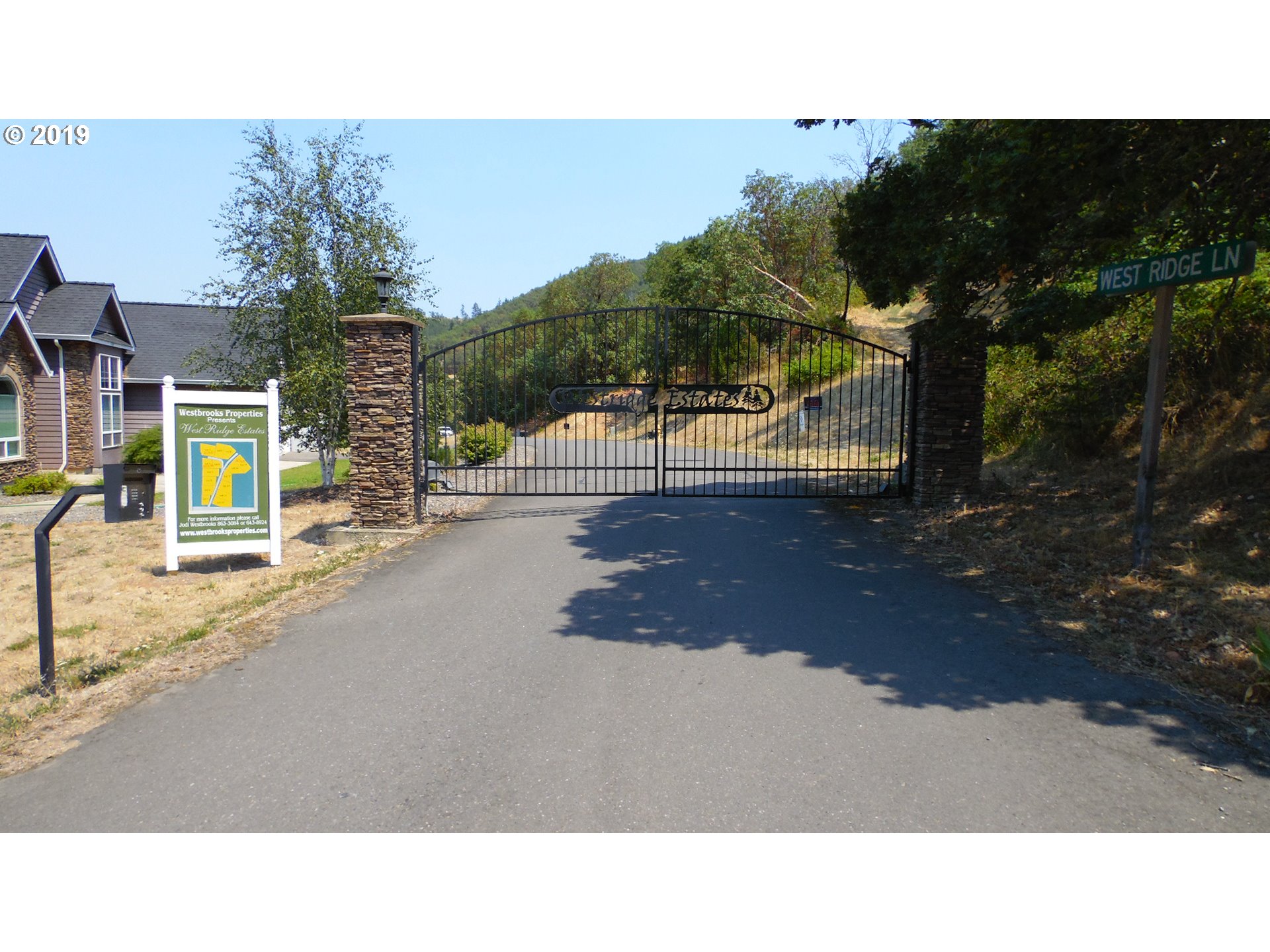 115 West Ridge Lane Myrtle Creek, OR 97457 - Photo 1 of 11 a black and white photo of a road