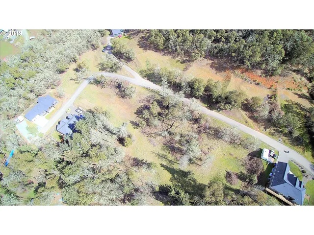 a room with a baby crib and a wooden floor