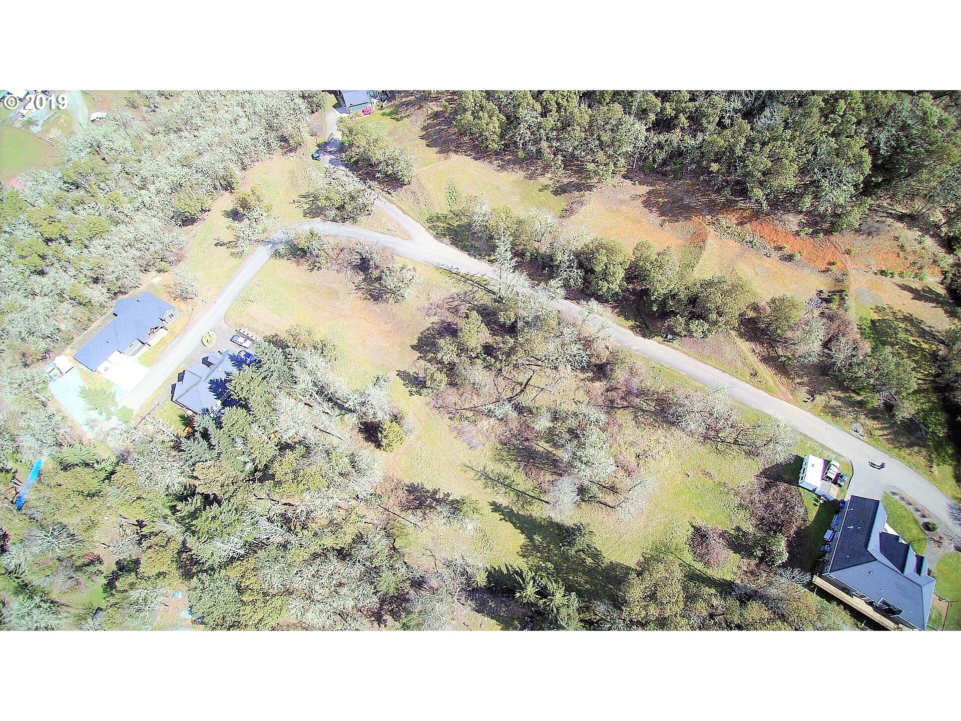 115 West Ridge Lane Myrtle Creek, OR 97457 - Photo 10 of 11 a black and white photo of a lake