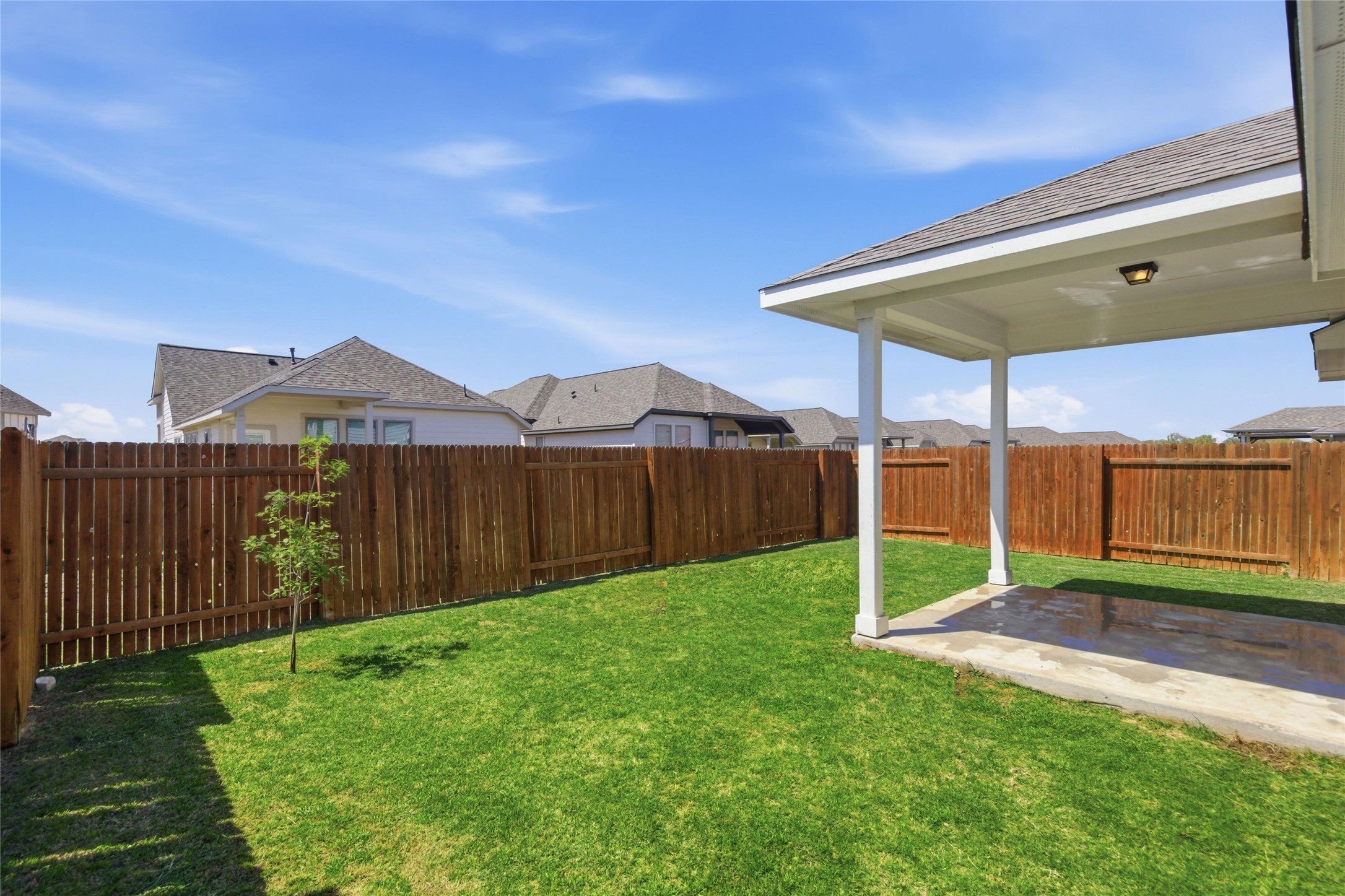 269 Gaida Loop Georgetown, TX 78628 - Photo 19 of 20 Fenced backyard featuring a patio area and a residential view