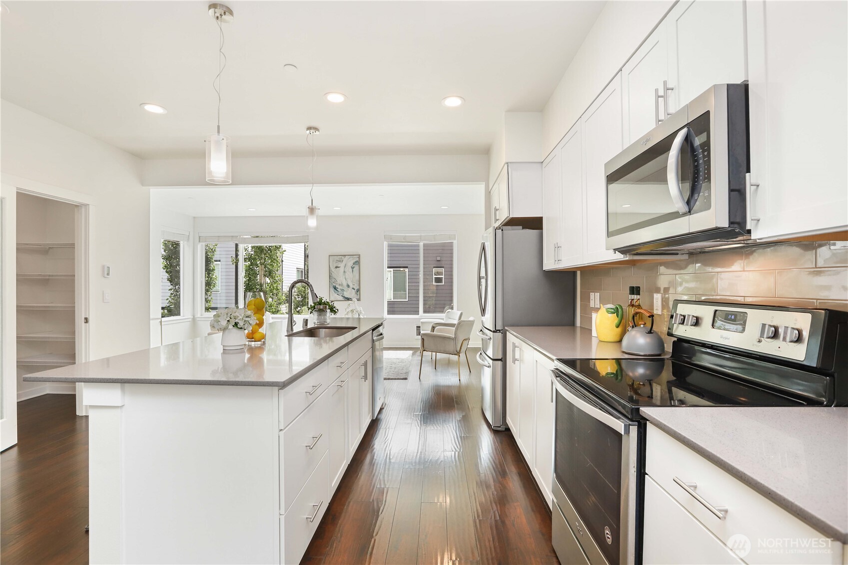 14913 48th Avenue West, Unit C4 Edmonds, WA 98026 - Photo 12 of 32 a large kitchen with stainless steel appliances granite countertop a lot of counter space and a wooden floors