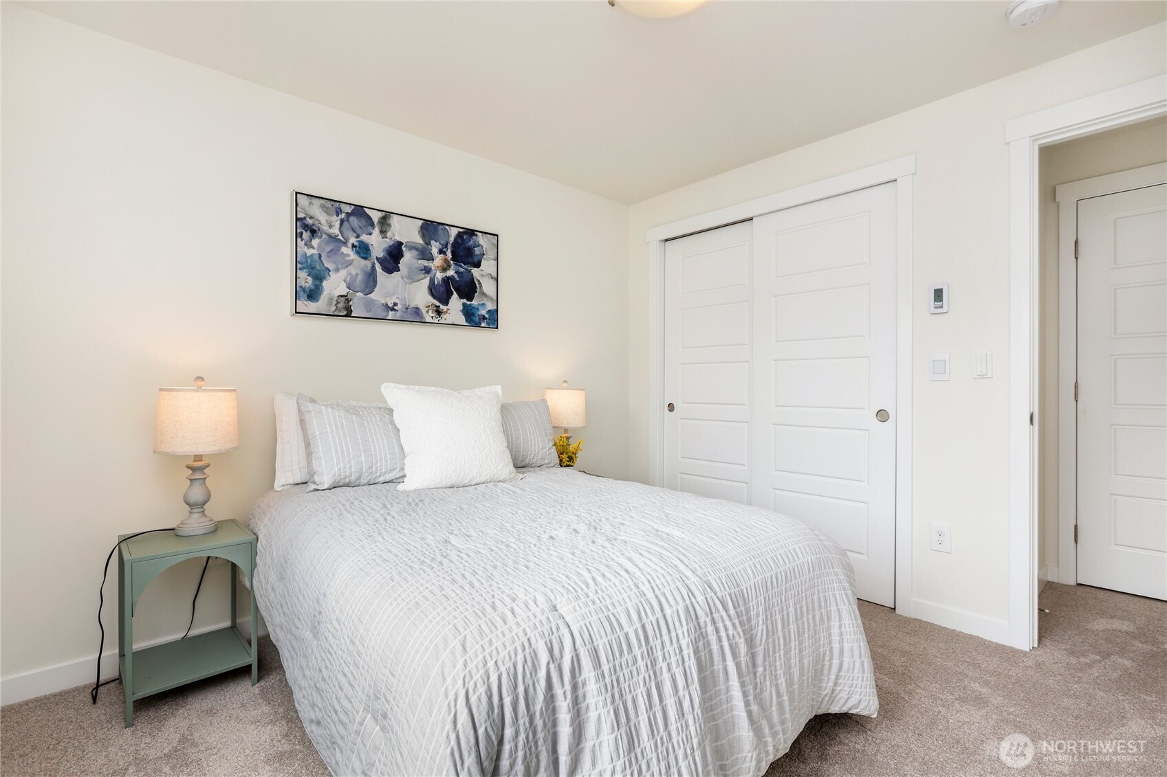 14913 48th Avenue West, Unit C4 Edmonds, WA 98026 - Photo 27 of 32 a bedroom with a bed and a chair