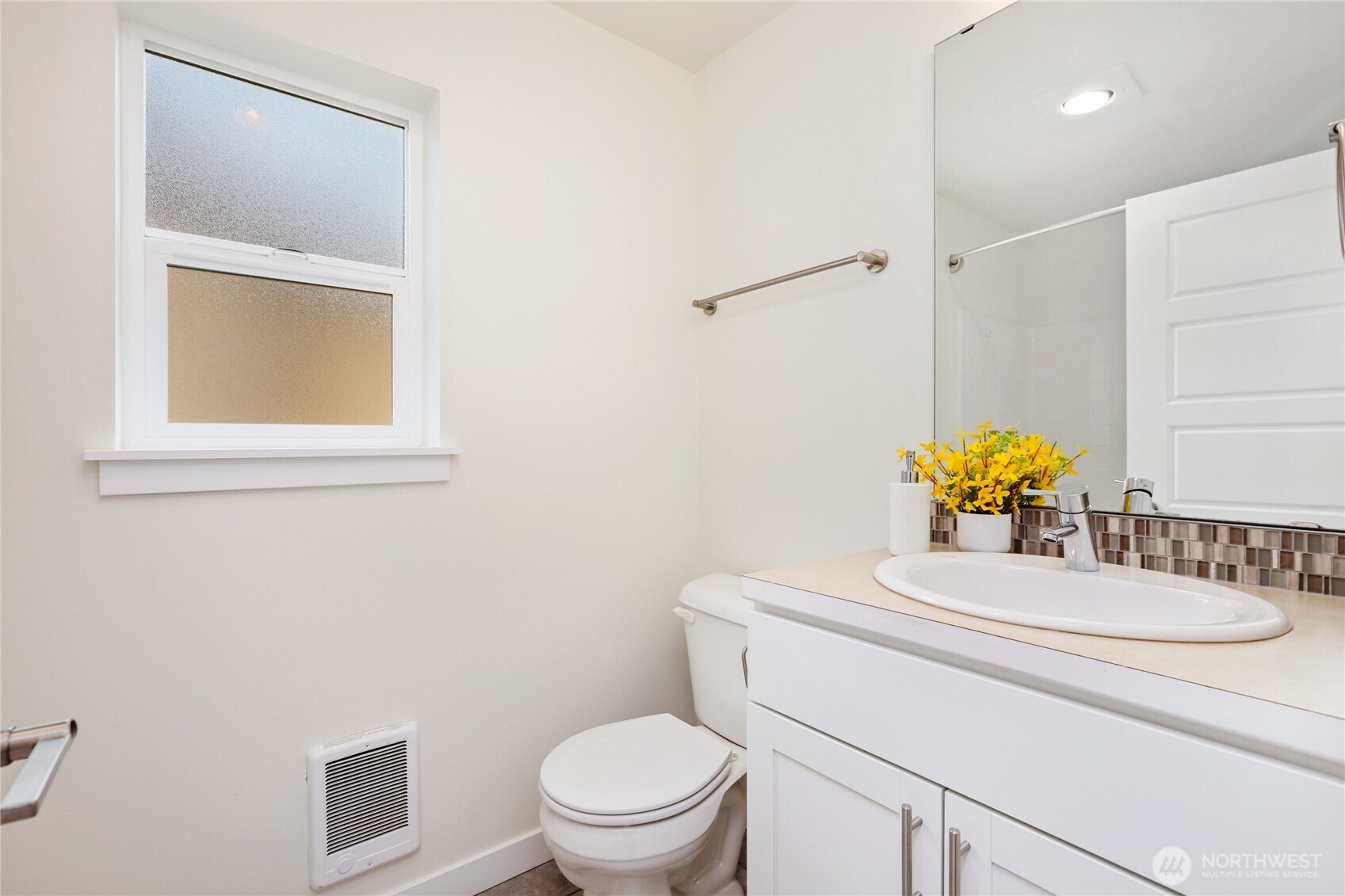 14913 48th Avenue West, Unit C4 Edmonds, WA 98026 - Photo 28 of 32 a bathroom with a toilet sink vanity and mirror