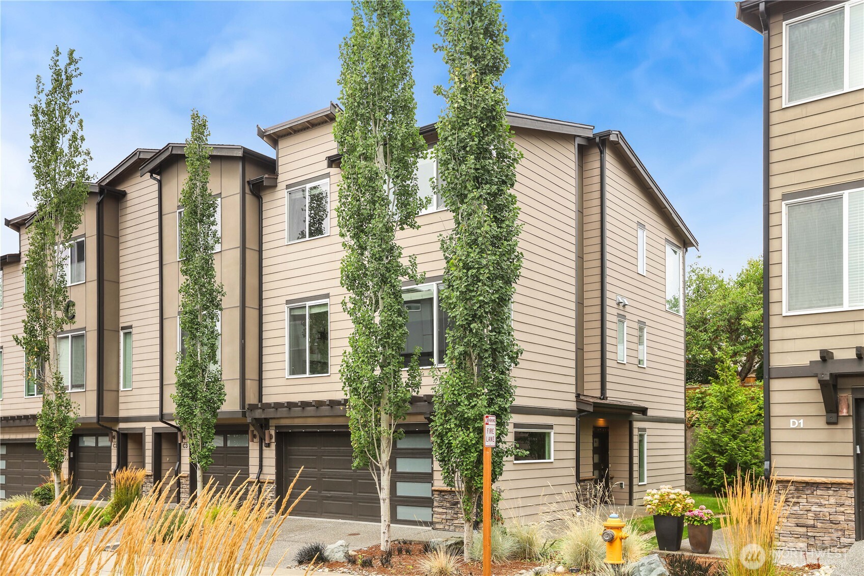 14913 48th Avenue West, Unit C4 Edmonds, WA 98026 - Photo 32 of 32 a front view of a house with a yard