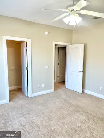a view of a room with a table and chairs