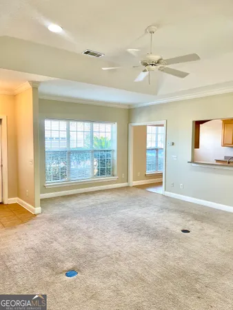 a view of an empty room with a window