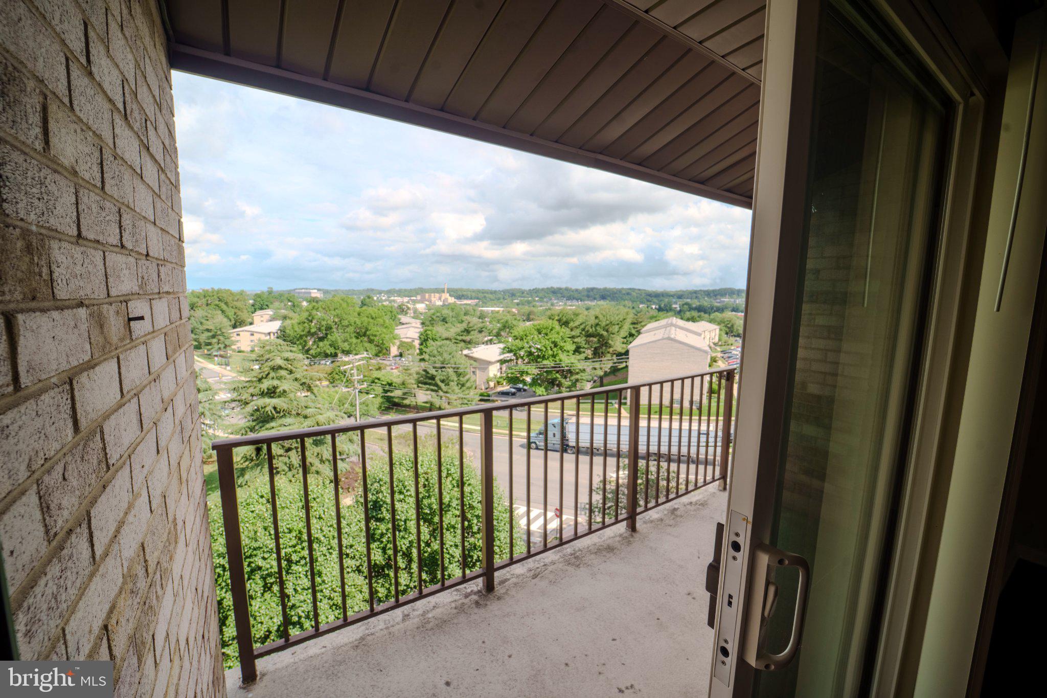 6147 Edsall Road, Unit N Alexandria, VA 22304 - Photo 26 of 28 Scenic balcony view of lush greenery.