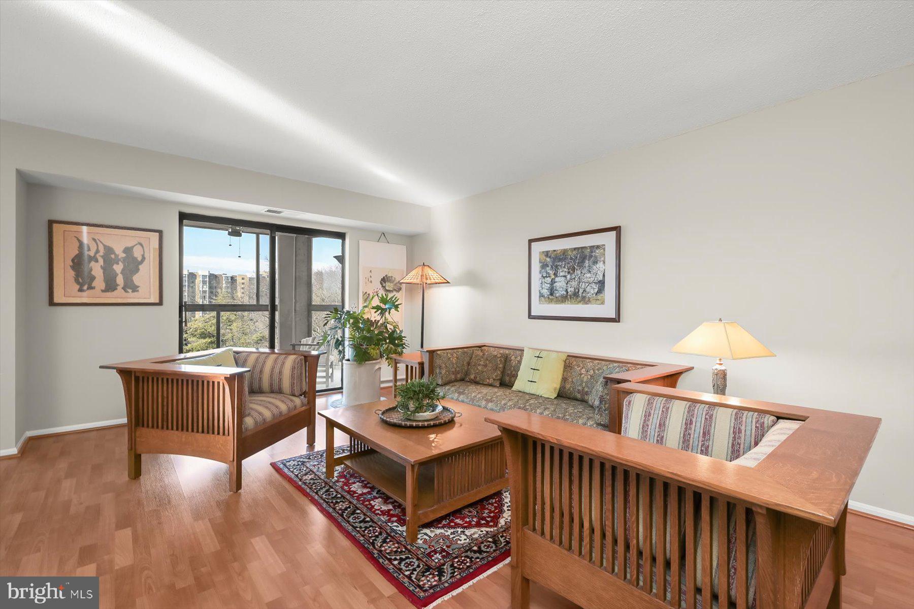 15107 Interlachen Drive, Unit 2725 Silver Spring, MD 20906 - Photo 11 of 35 a living room with furniture and a window