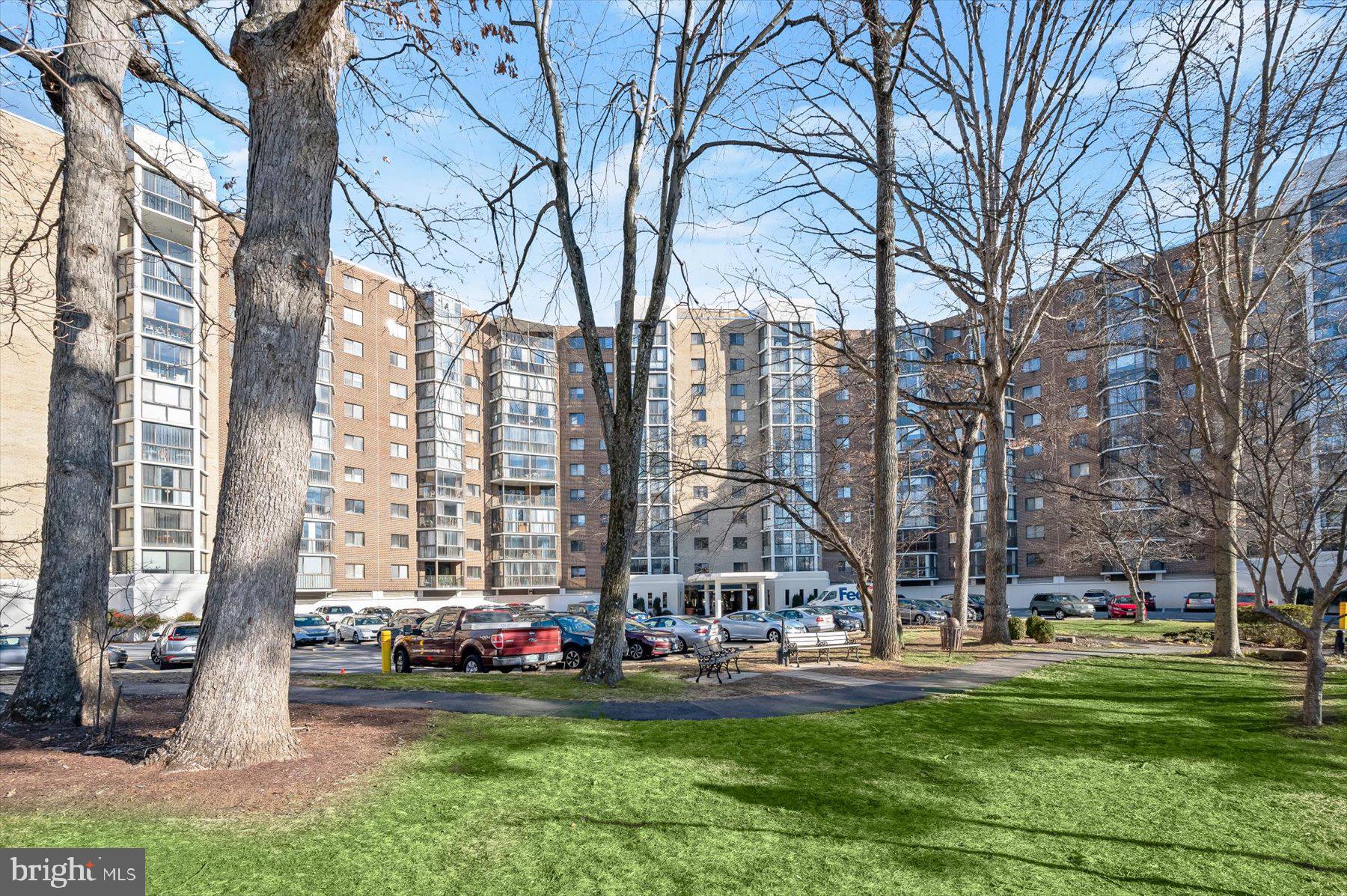 15107 Interlachen Drive, Unit 2725 Silver Spring, MD 20906 - Photo 4 of 35 a view of a building with cars parked
