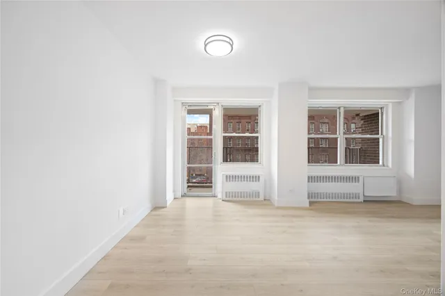 a view of a kitchen with wooden floor