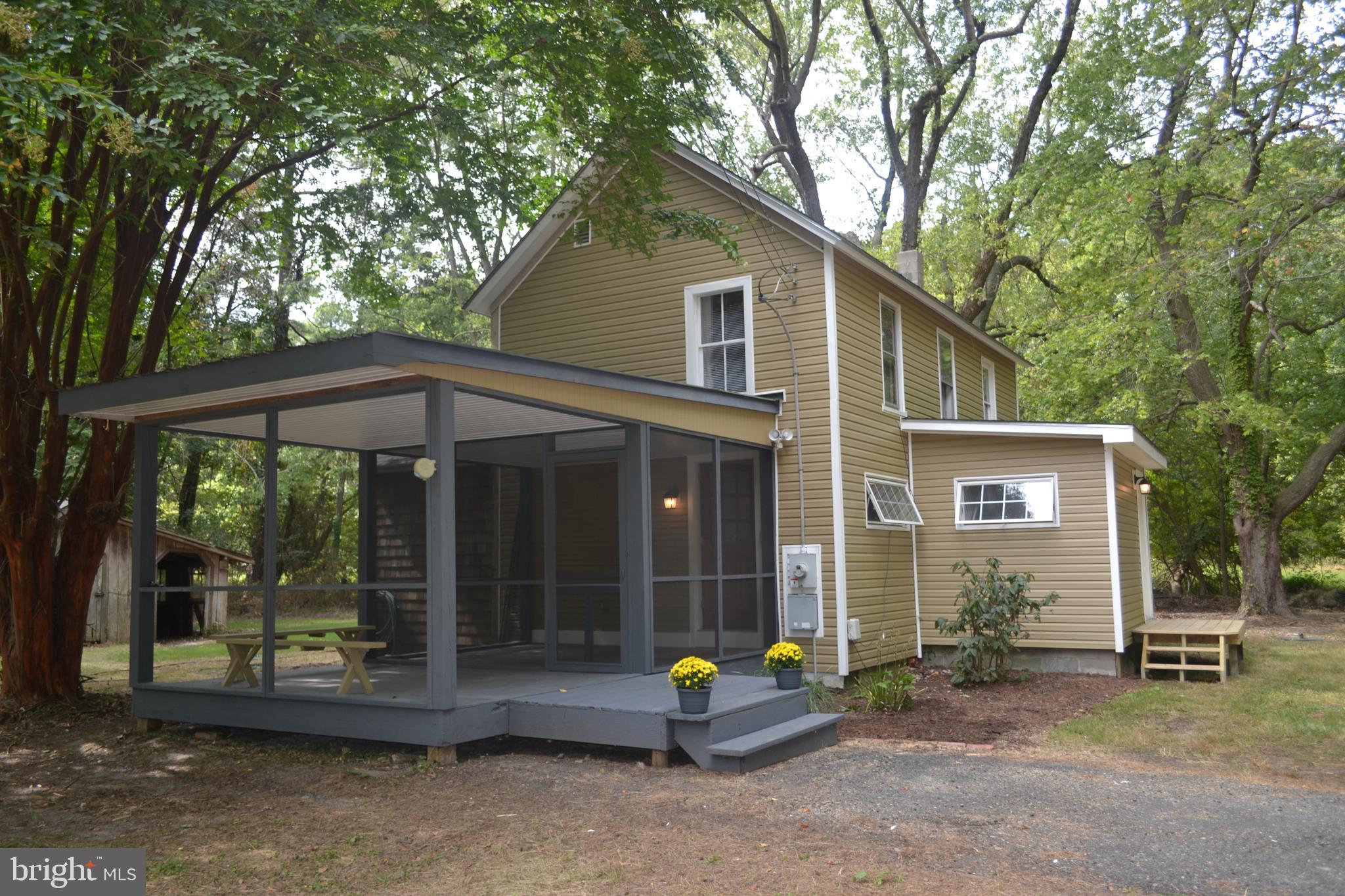 23261 Bush Neck Road Bozman, MD 21612 - Photo 2 of 27 Relax on the covered porch and the screened porch