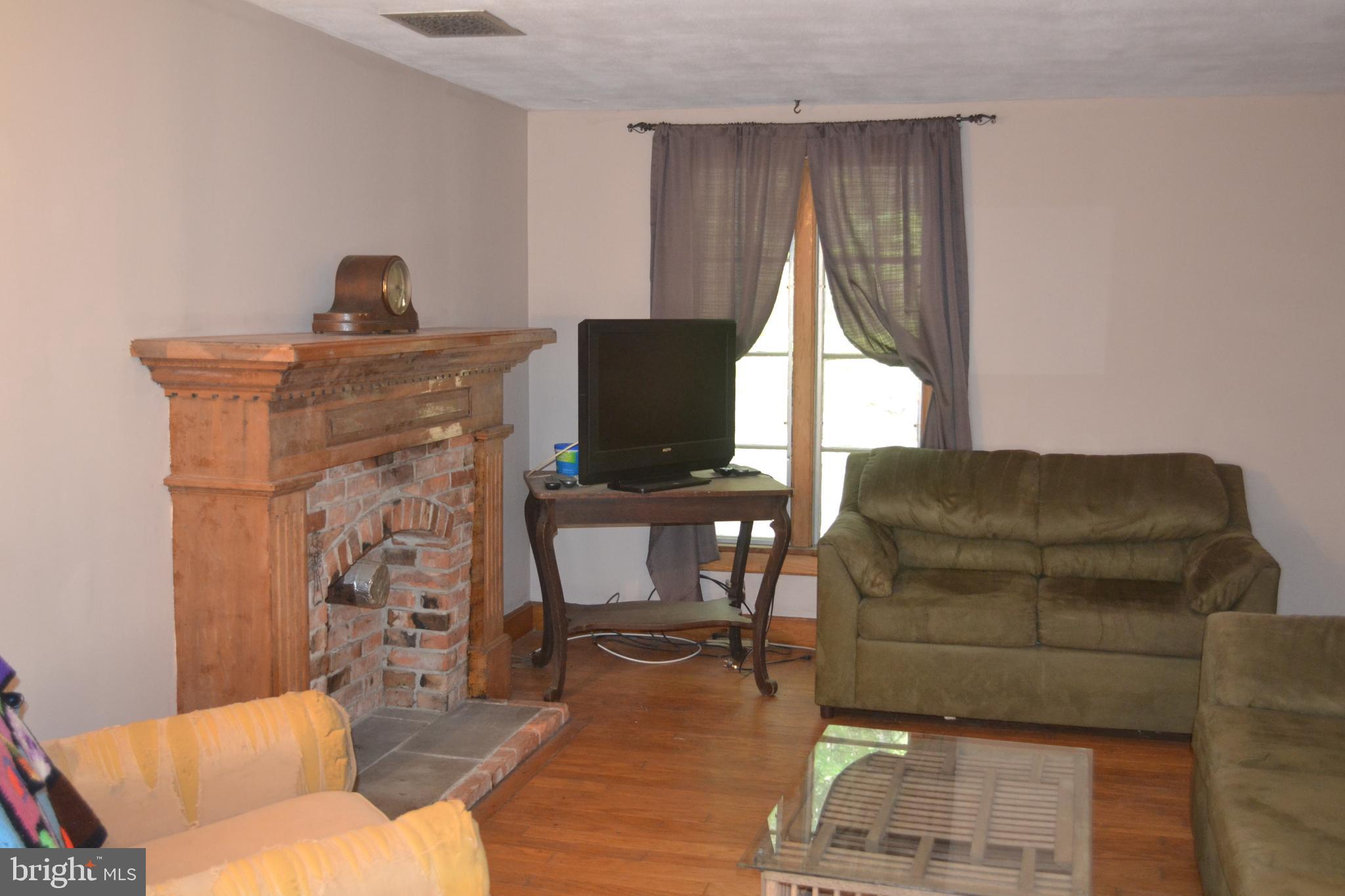23261 Bush Neck Road Bozman, MD 21612 - Photo 12 of 27 Living room with hardwood floors