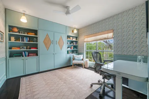 a living room with furniture window and a wooden floor