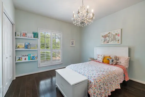 a bedroom with bed and a window