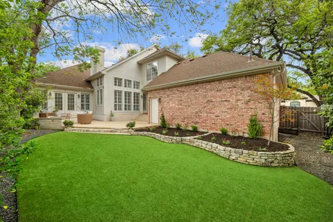 a front view of house with yard and outdoor seating