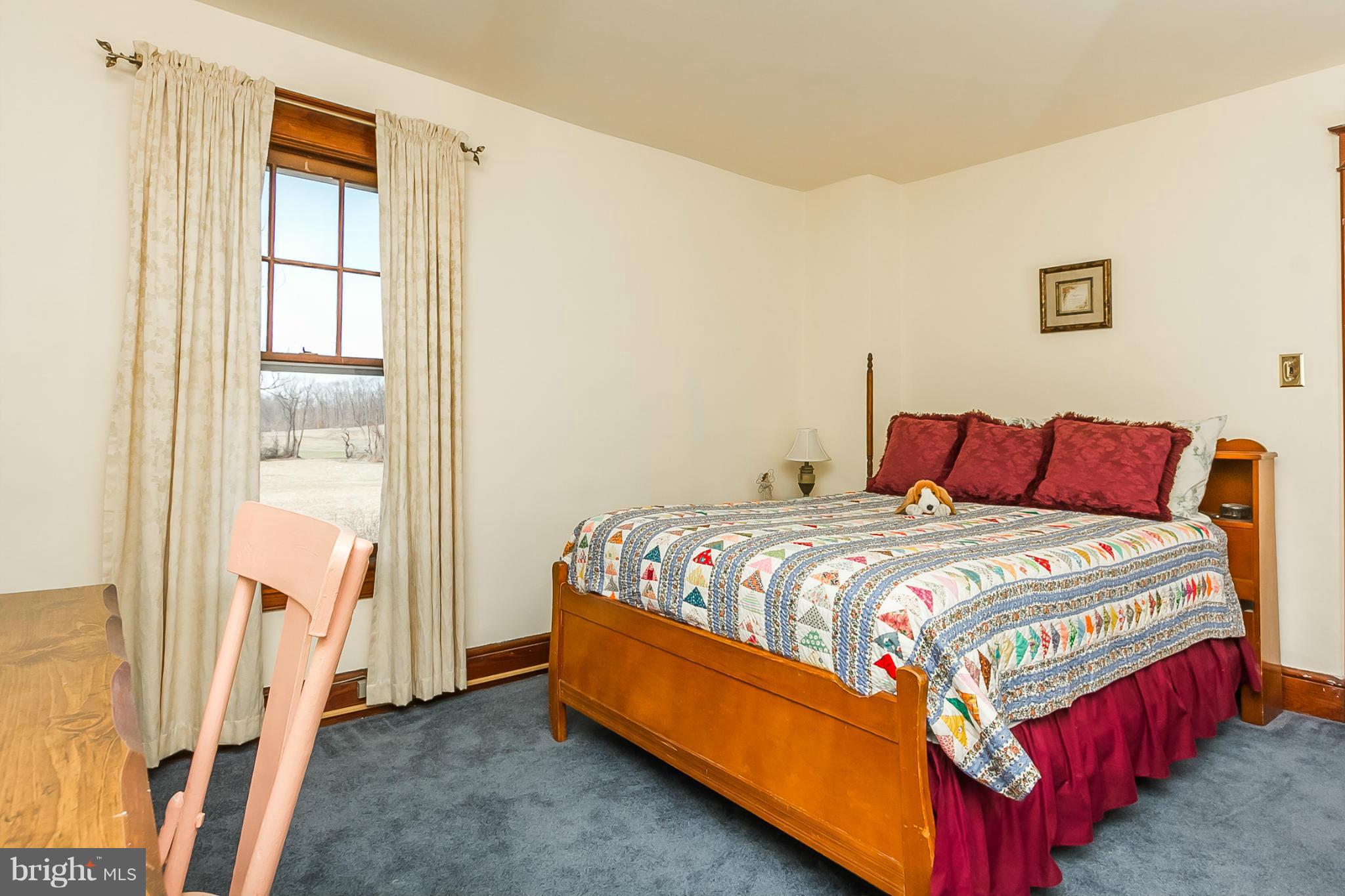4524 Norrisville Road White Hall, MD 21161 - Photo 11 of 21 a bedroom with a bed and window