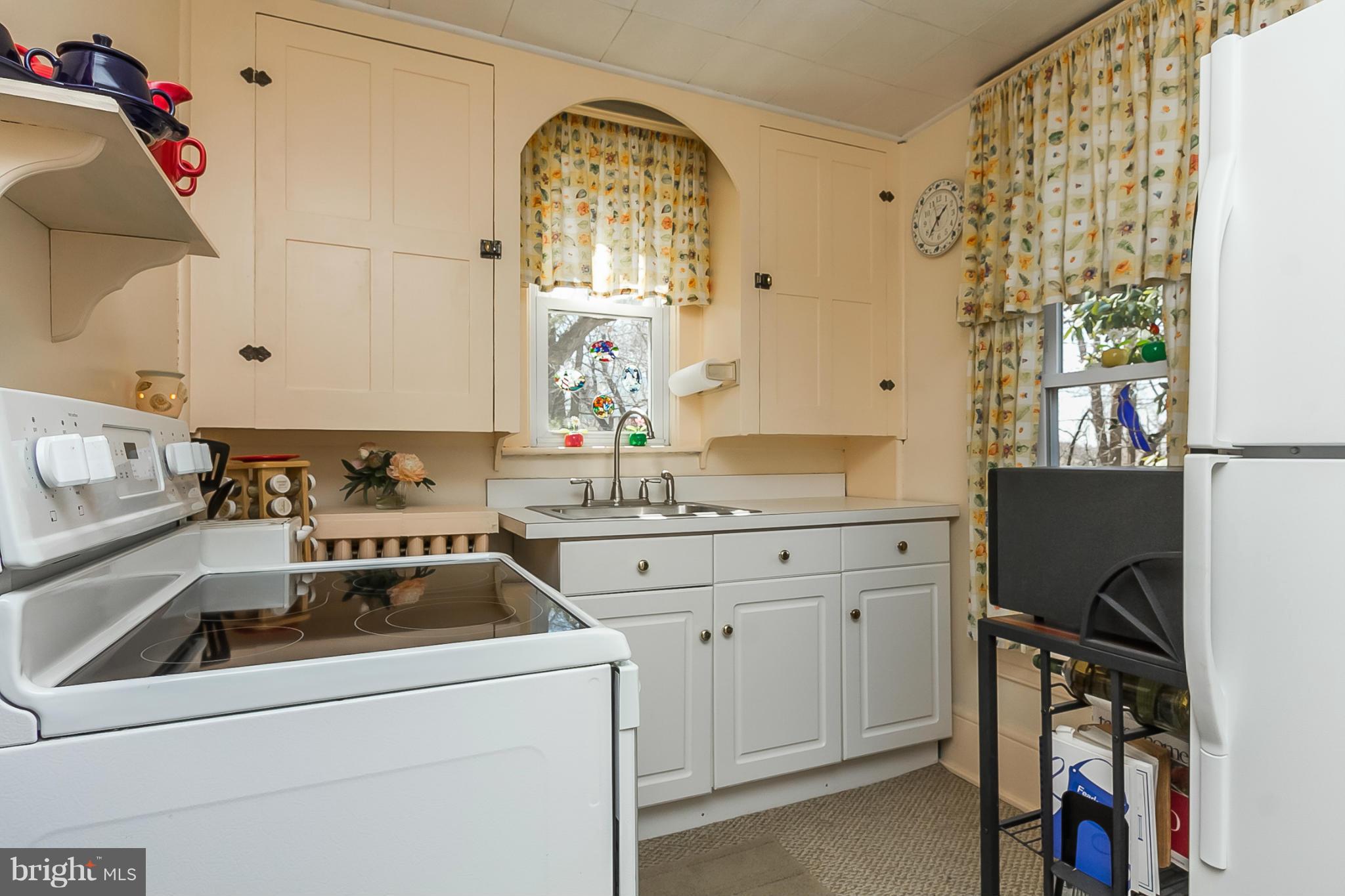 4524 Norrisville Road White Hall, MD 21161 - Photo 7 of 21 a kitchen with a sink stove and cabinets