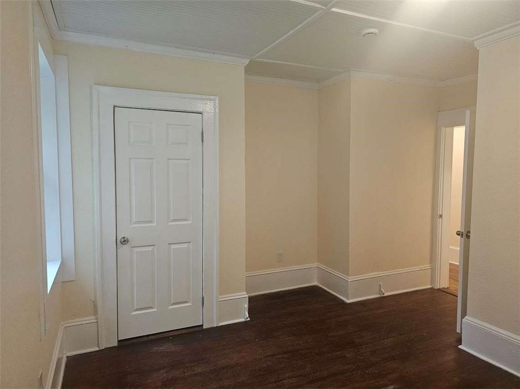 354 South Main Street Thomaston, GA 30286 - Photo 12 of 24 an empty room with wooden floor and closet