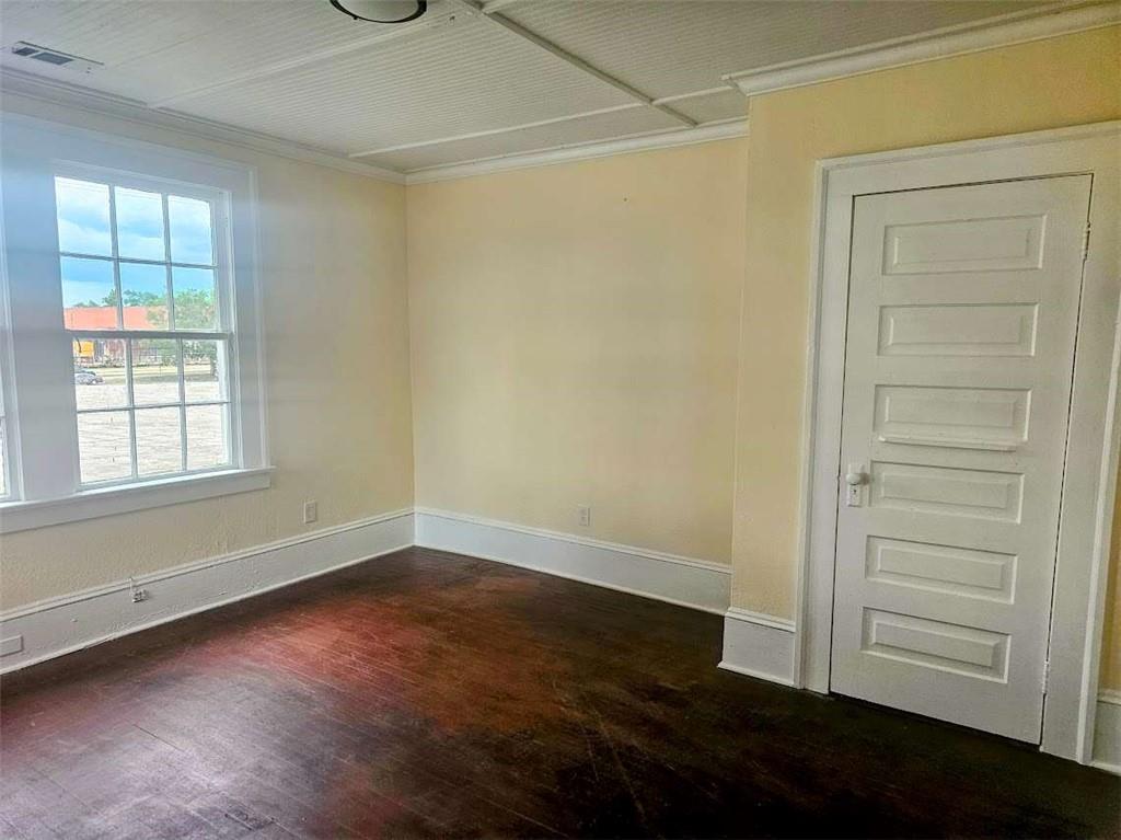354 South Main Street Thomaston, GA 30286 - Photo 14 of 24 wooden floor in an empty room with a window