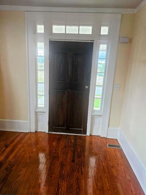 354 South Main Street Thomaston, GA 30286 - Photo 3 of 24 a view of an empty room with wooden floor and a window