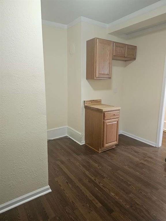 354 South Main Street Thomaston, GA 30286 - Photo 7 of 24 a room with wooden floor and cabinet